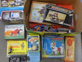 A box of vintage toys and games including Sutcliffe Atomic Submarine, Totopoly, battery powered