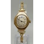 An Art Deco 9ct gold wristwatch on a German made 1/20th 14ct gold bracelet strap