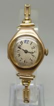 An Art Deco 9ct gold wristwatch on a German made 1/20th 14ct gold bracelet strap