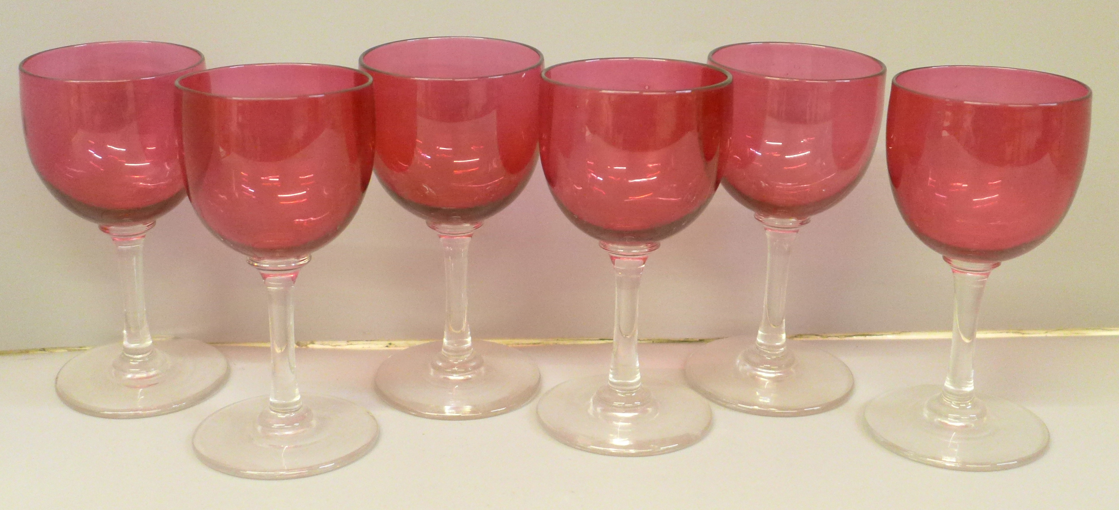 A set of six cranberry wine glasses