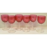 A set of six cranberry wine glasses