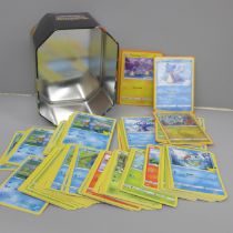 Over 140 McDonalds Pokemon cards in collectors tin