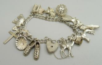 A silver charm bracelet, 40g