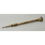 A gold tone propelling pencil with agate stone detail