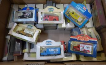 Twenty-five Corgi and Lledo model vehicles including Del Boy's Reliant Van, boxed and three loose