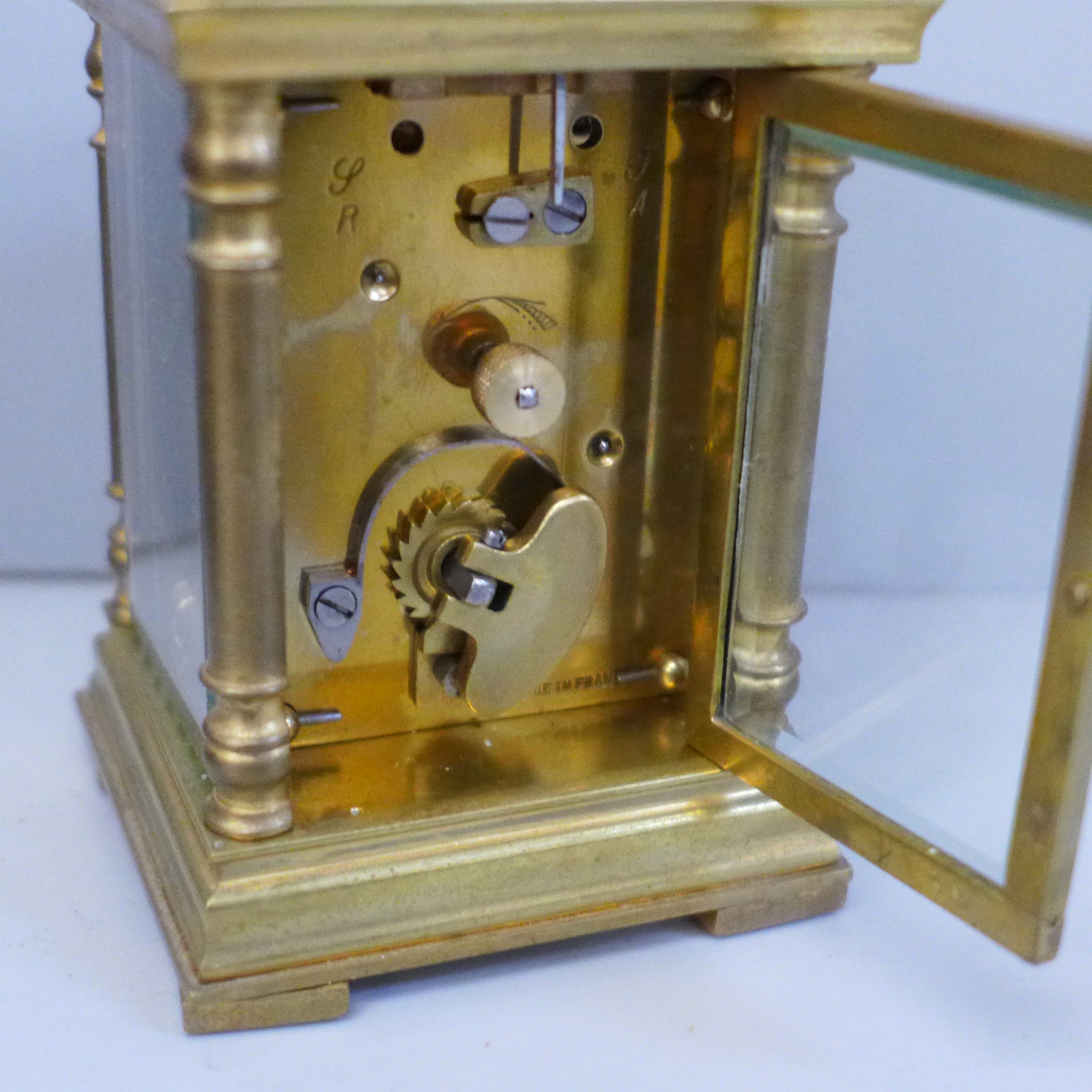A small brass and four glass sided carriage clock with French movement, inscription to case top in a - Image 4 of 7