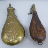 A leather and brass shot flask and one other shot flask containing shot