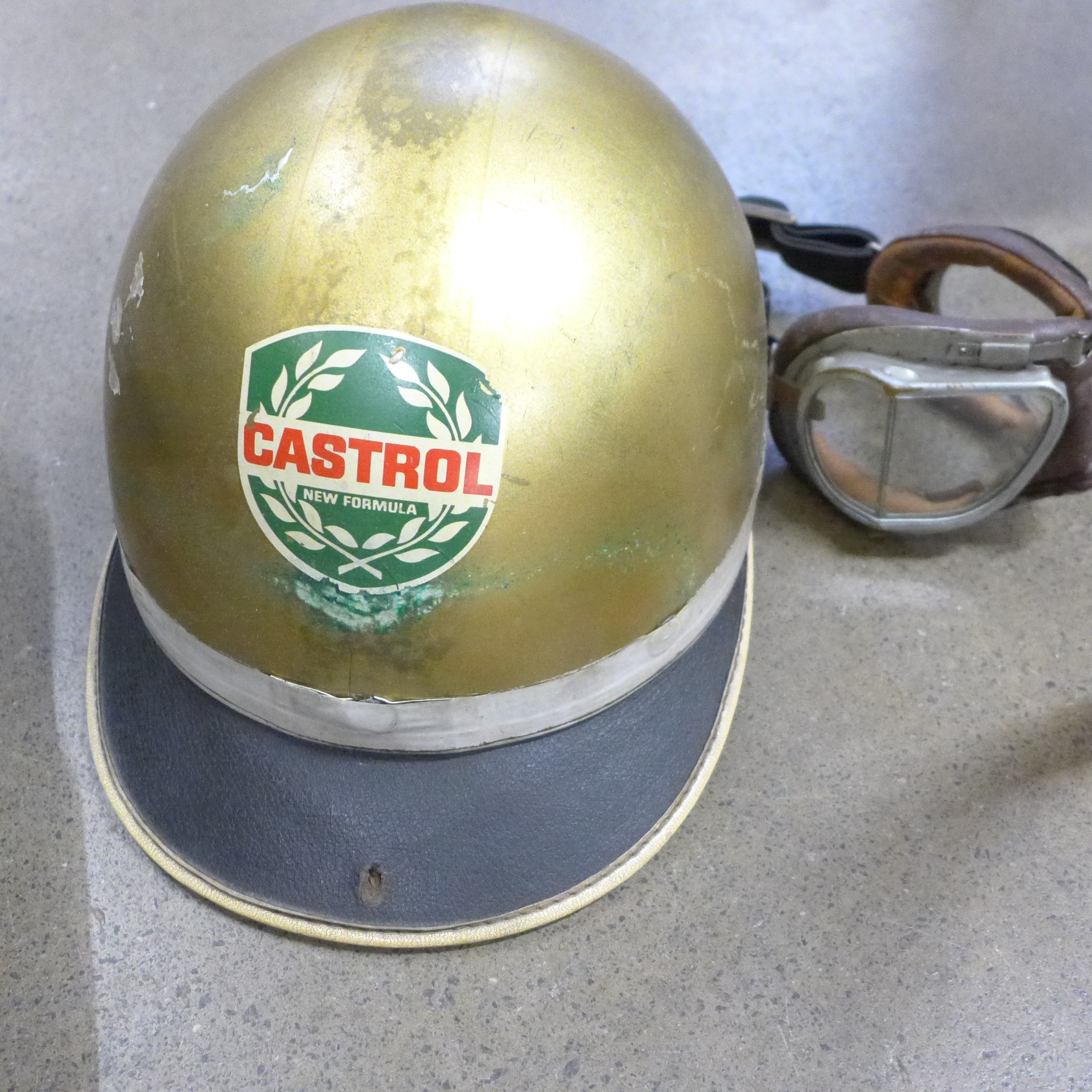A collection of car parts, Castrol gold helmet, two pairs of driving goggles, steering wheel, rev - Image 8 of 11