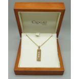 A limited edition Clogau Welsh 9ct gold ingot style pendant of Celtic design, set with three small