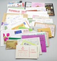 Stamps; a small box of worldwide stamp booklets, (100+)