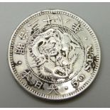 A Chinese silver 50 Sen coin