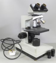 A cased microscope **PLEASE NOTE THIS LOT IS NOT ELIGIBLE FOR POSTING AND PACKING**