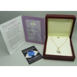 An 18ct yellow gold pendant set with small diamonds and three pear shape grade AAA tanzanite stones,