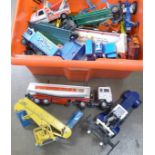 A collection of playworn model vehicles including Dinky and Corgi