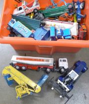 A collection of playworn model vehicles including Dinky and Corgi