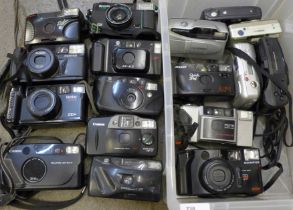 A collection of 35mm film and early digital cameras