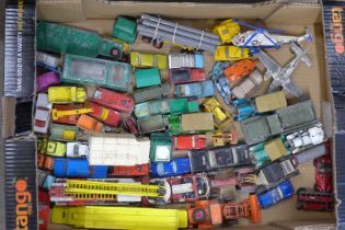 A collection of approximately 60 Lesney Matchbox/Corgi/Dinky Toy die-cast model vehicles from the