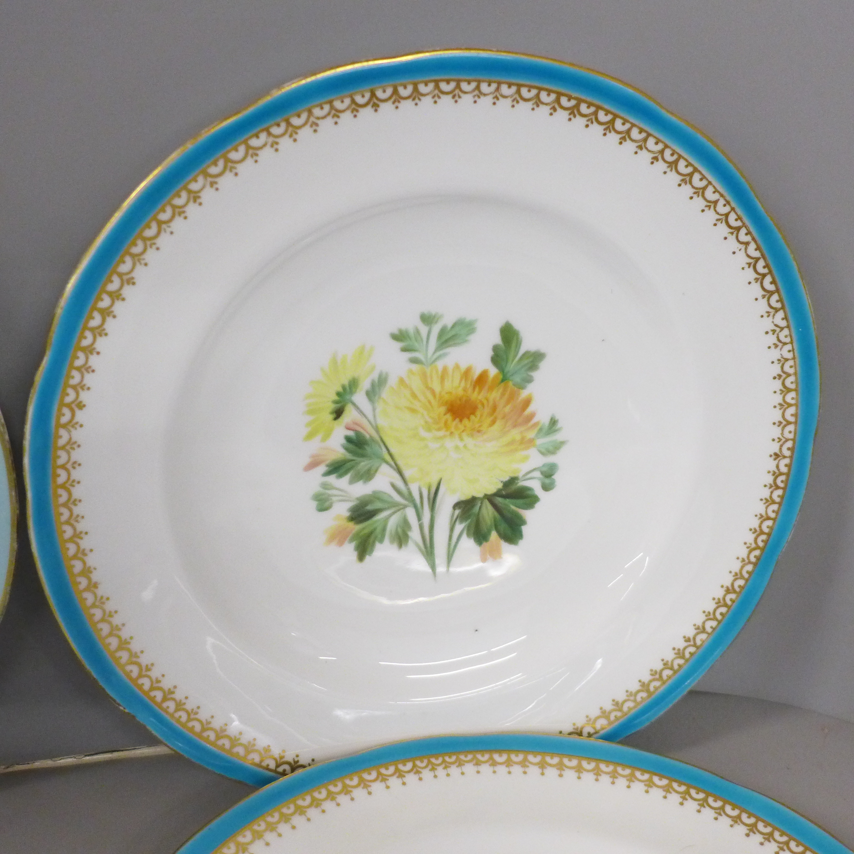 A set of four cabinet plates with duck egg blue border and hand painted floral decoration and two - Image 3 of 4