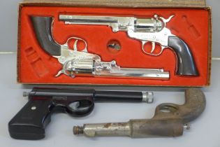 Two pellet guns and a pair of Mustang boxed cap guns