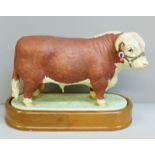 A Royal Worcester figure of a Hereford Bull, 0383H backstamp, on a wooden stand