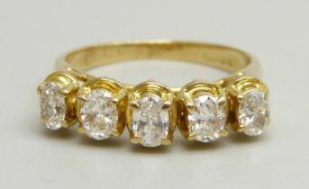 An 18ct yellow gold ring set with five oval brilliant cut diamonds, G clarity, 3g, I