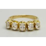 An 18ct yellow gold ring set with five oval brilliant cut diamonds, G clarity, 3g, I