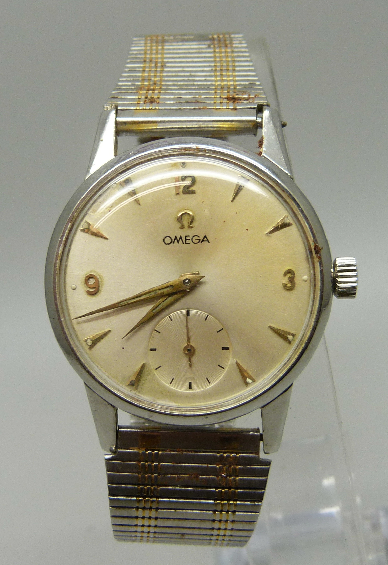 A gentleman's Omega wristwatch with subsidiary second hand, the case back bears inscription dated
