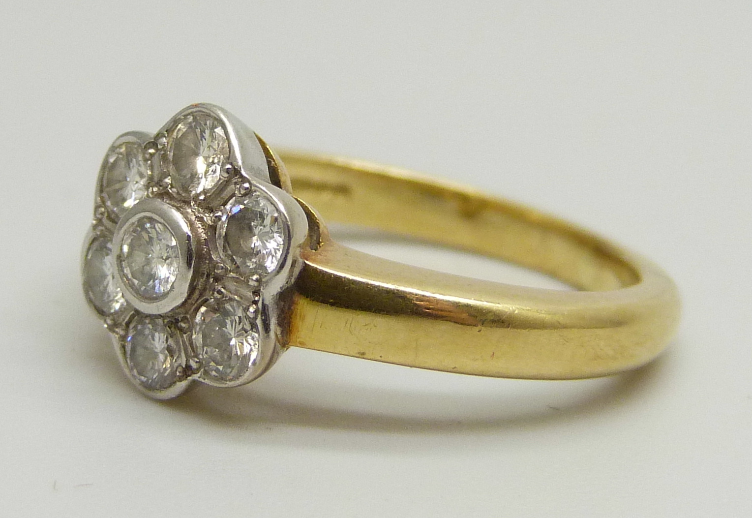 An 18ct yellow gold daisy cluster ring set with seven round brilliant cut diamonds, approximately - Image 2 of 4