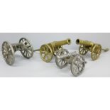 Four model cannons, two plate and two brass