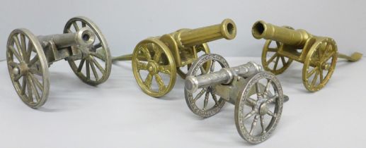 Four model cannons, two plate and two brass