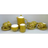 A Langley Pottery coffee set; six cups, six saucers, a milk jug, sugar bowl and coffee pot