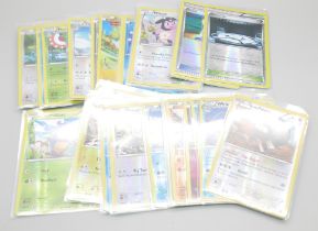 40 Vintage holographic Pokemon cards in protective sleeves