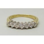 An 18ct yellow gold ring set with seven round brilliant cut diamonds, approximately 0.33ct, I/J