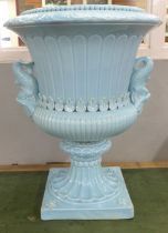 A large pale blue glazed ceramic garden urn with fish handles, 55cm