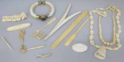 A collection of bone and faux ivory jewellery