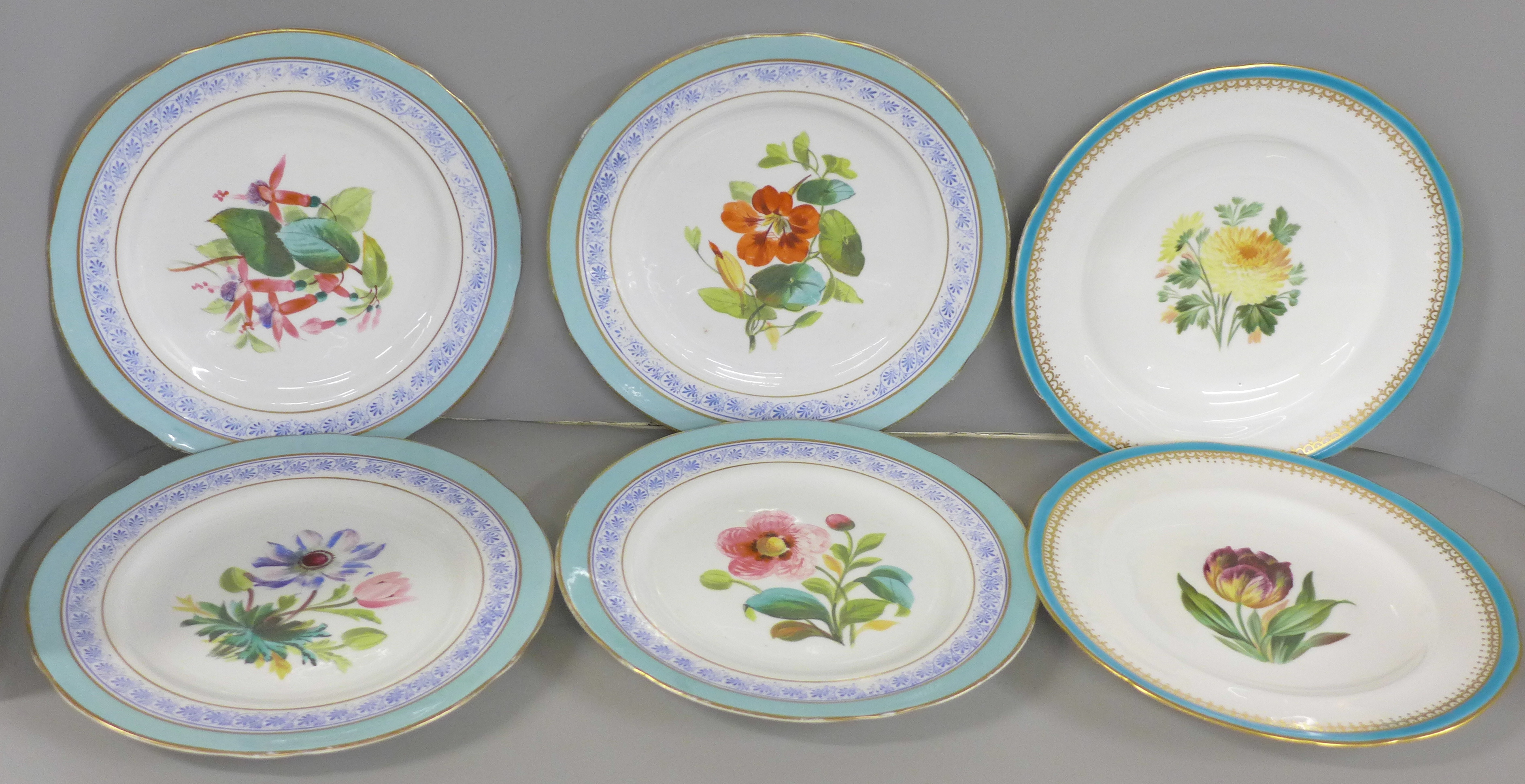 A set of four cabinet plates with duck egg blue border and hand painted floral decoration and two