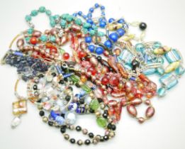 A collection of glass necklaces, a Murano glass necklaces, an iolite bead necklace, etc.