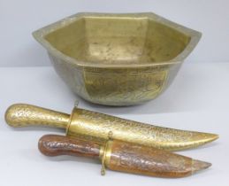 Two brass daggers and a Chinese brass bowl