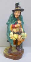 A Royal Doulton figure, The Mask Seller, HN2103