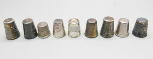 Eight silver thimbles and one other thimble