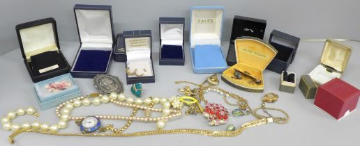 A small collection of jewellery boxes, a collection of costume jewellery including hand made West