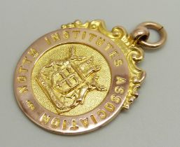 A 9ct rose gold 'Nottingham Institutes Association' fob medal, Table Tennis Champs 1934-5, 7.3g