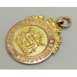 A 9ct rose gold 'Nottingham Institutes Association' fob medal, Table Tennis Champs 1934-5, 7.3g