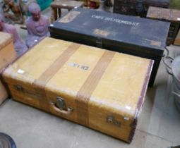 A vintage suitcase and a military trunk