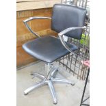 A REM chrome and leather office chair