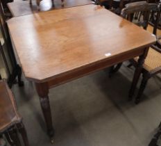 A Victorian oak kitchen table