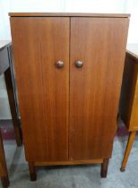 A teak two door record cabinet