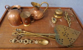 A mixed lot of copper and brass ware including a companion set, tankards and decorative items