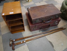 Two leather suitcases, a letter rack and two walking canes