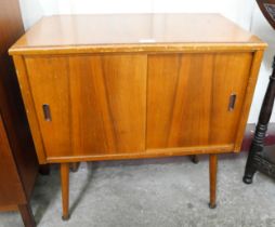 A walnut sliding door record cabinet